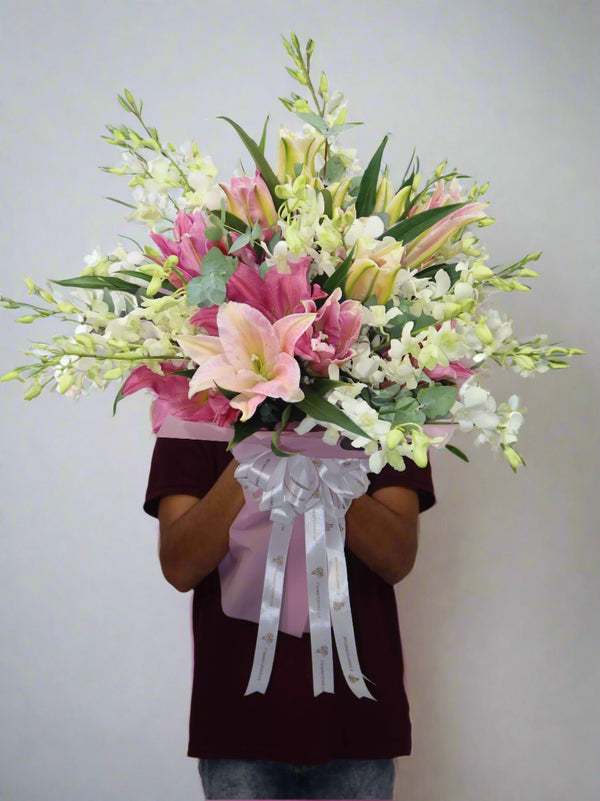 pink lilies with white orchids